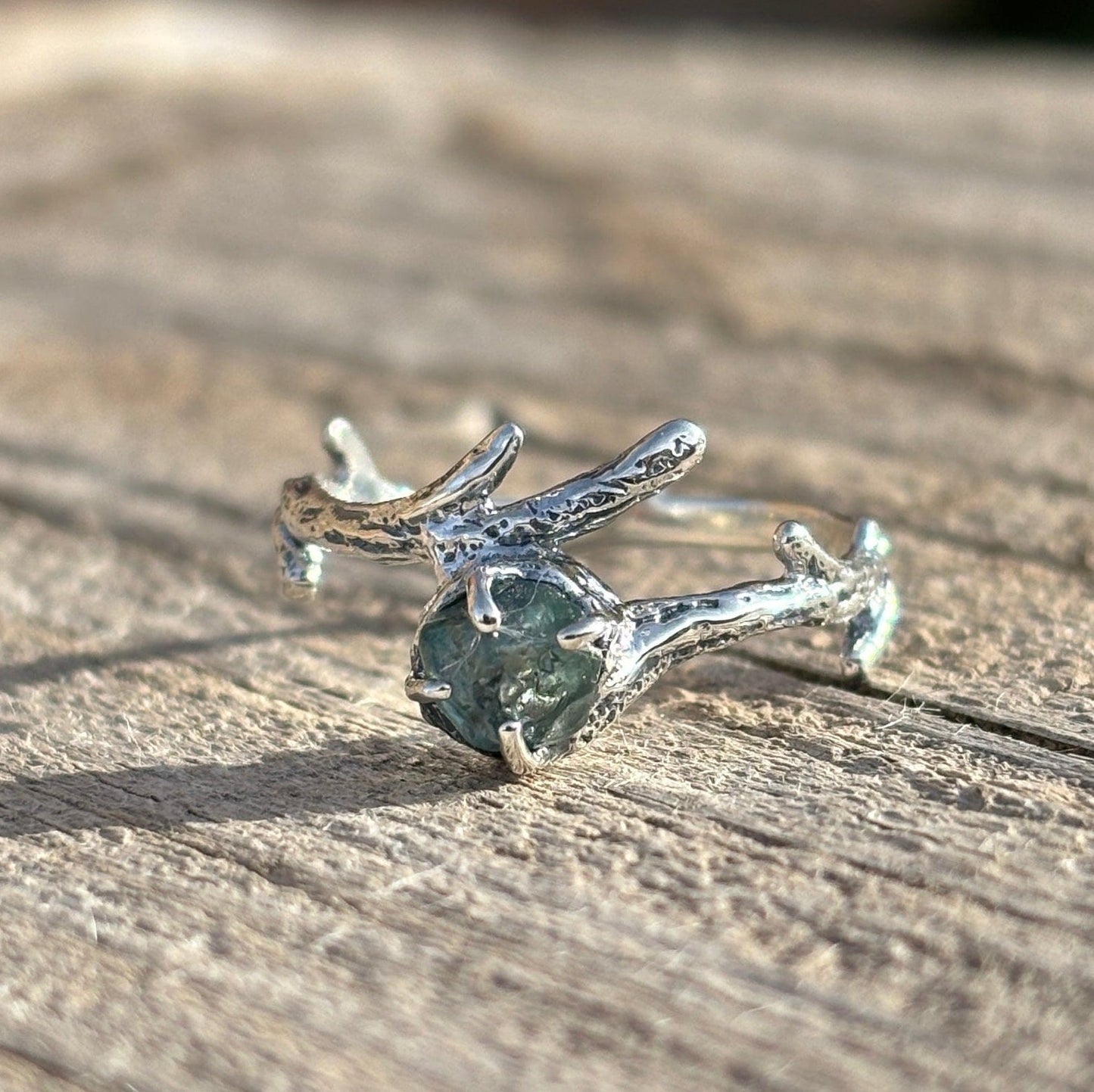 Silver branch textured ring with a  raw, uncut Montana sapphire.