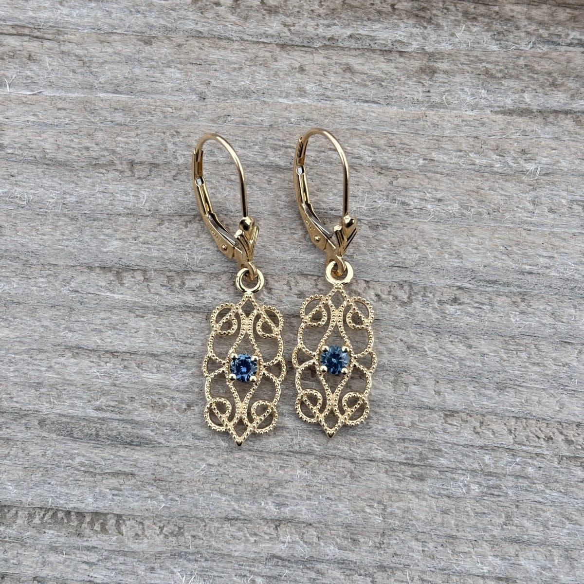 Gold filigree dangle with blue Montana sapphire 