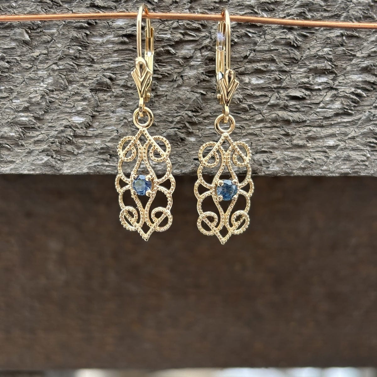 Gold filigree dangle with blue Montana sapphire 