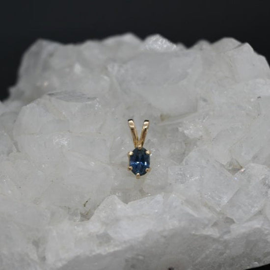 Gold pendant with a rich blue Montana sapphire 