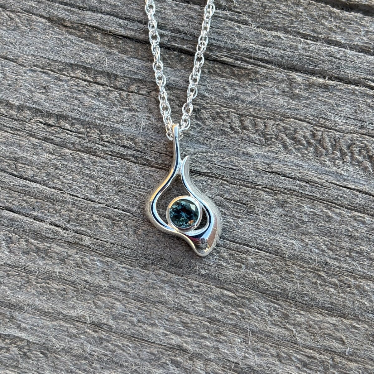 Silver pendant necklace with a blue Montana sapphire 