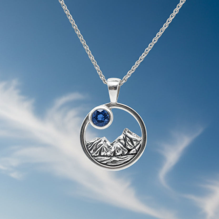 4mm Big Sky Sapphire Rustic round Mountain Pendant on crystal
