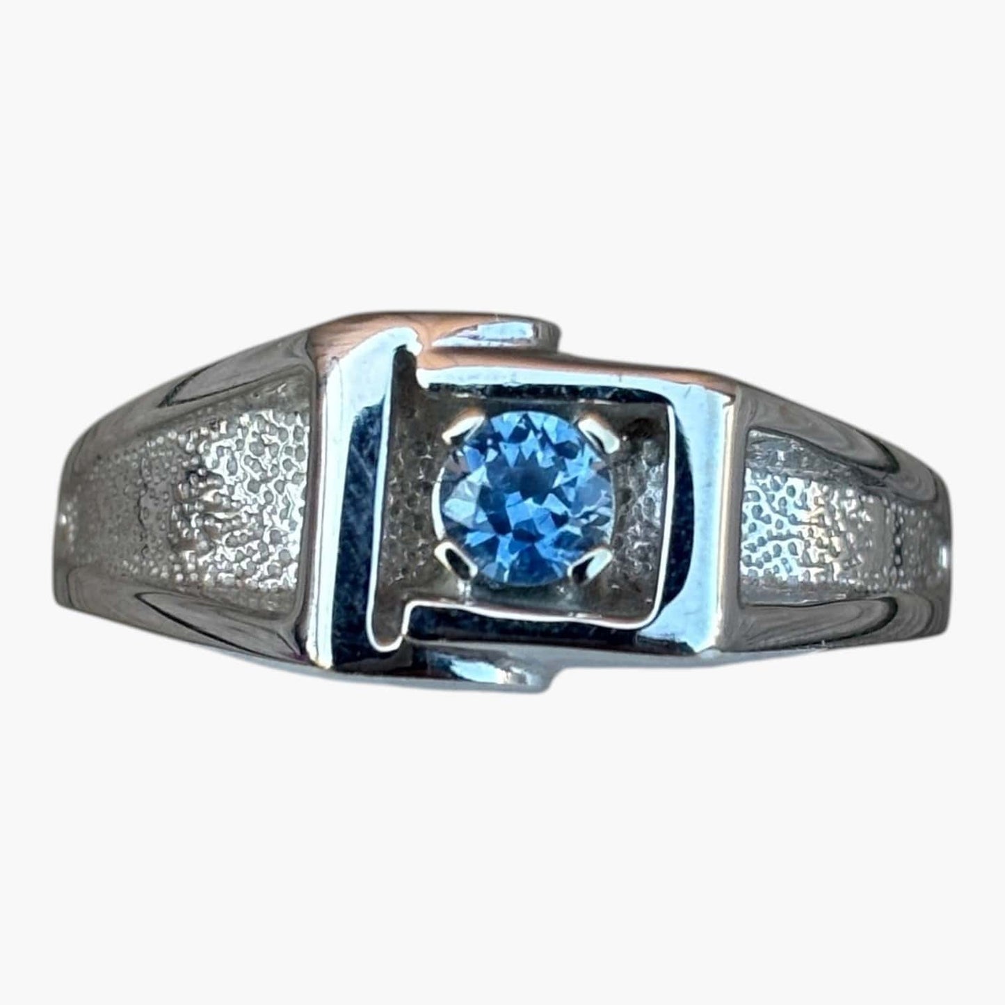 mens white gold ring with textured band and pretty medium blue 4mm Montana sapphire as the center. 