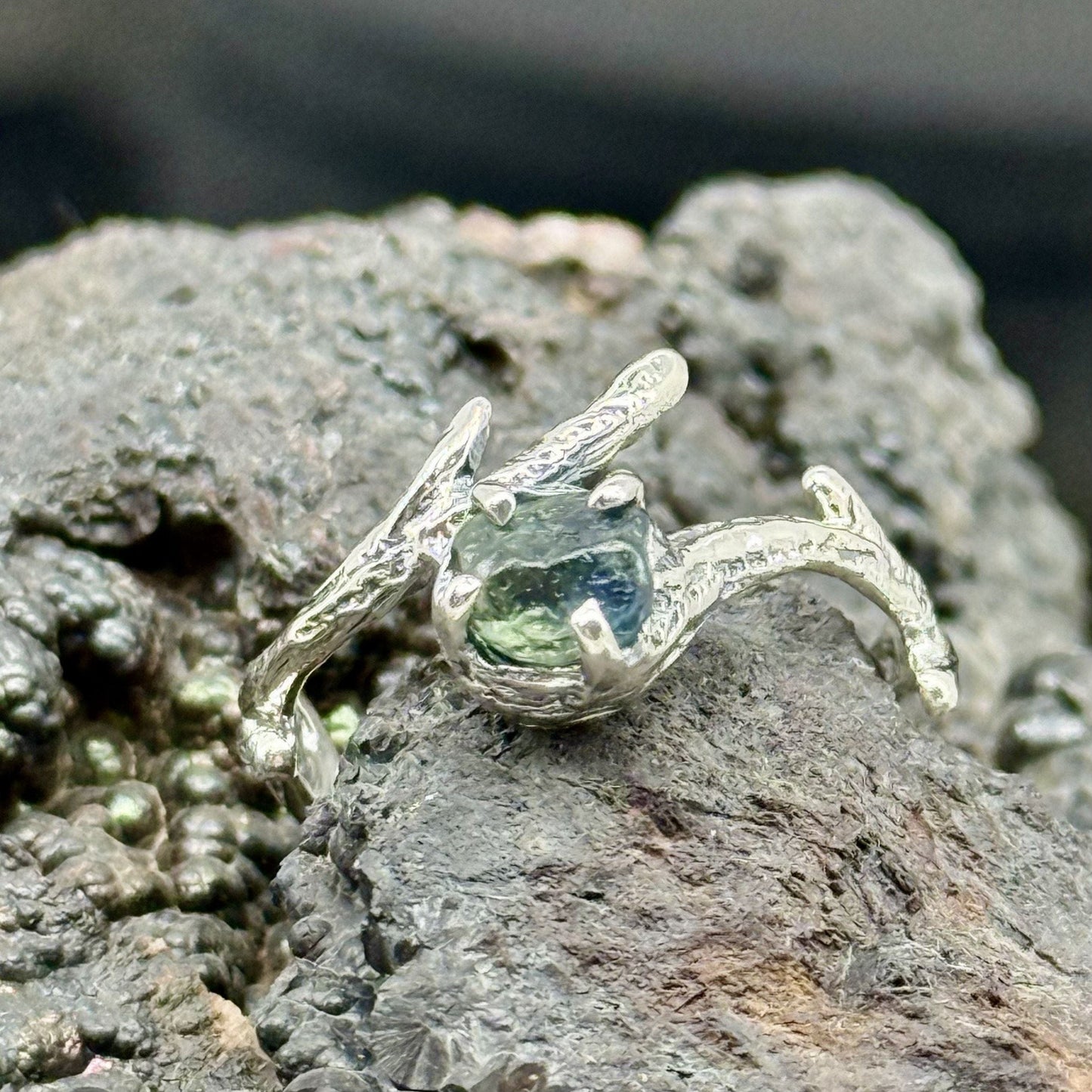 Organic style sterling silver branch textured ring with uncut sapphire