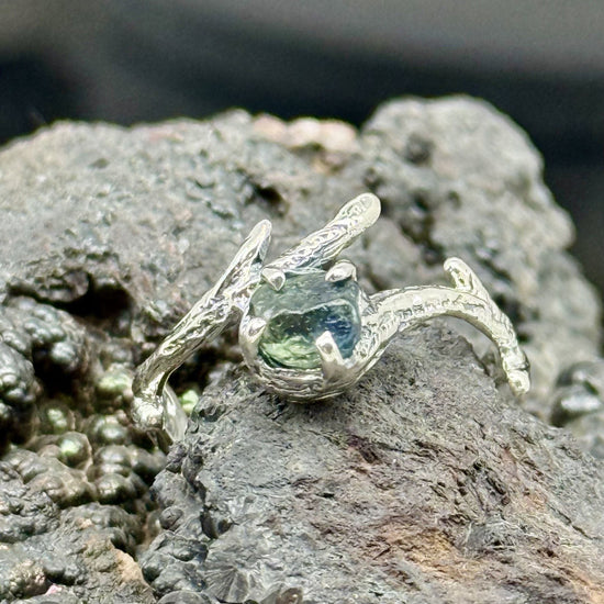 Organic style sterling silver branch textured ring with uncut sapphire