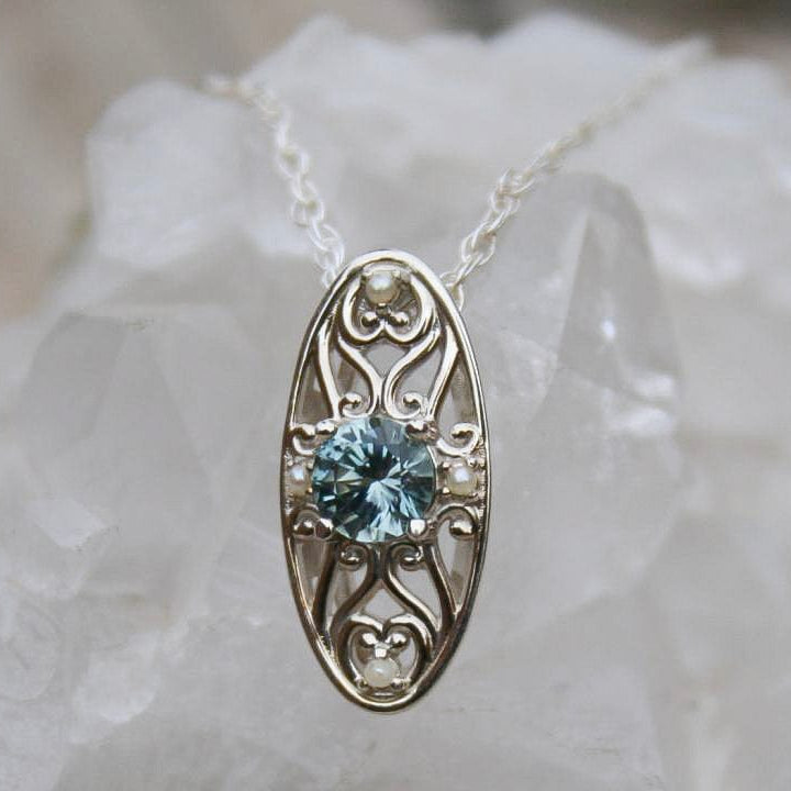 Light blue Montana sapphire floral  pendant necklace with pearls. 