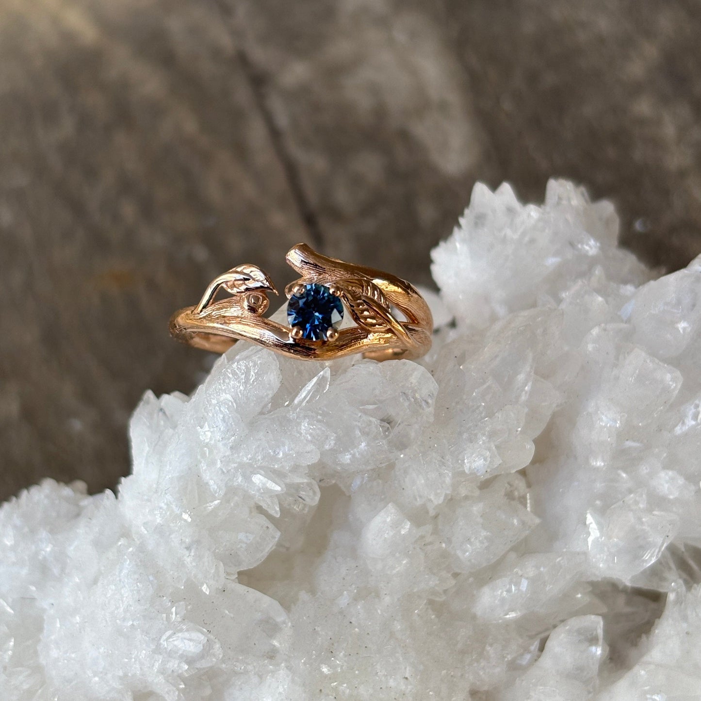 Rose Gold ring in branch stytle with a  round blue Montana sapphire