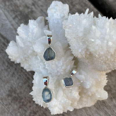 blue hued uncut sapphire pendant