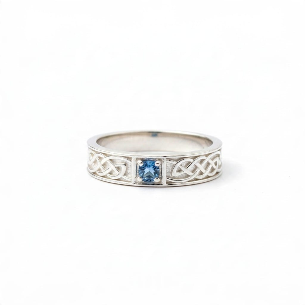 Montana Gems and Sapphire Jewelry sterling silver ring featuring a blue Montana sapphire in a Celtic knot band design.
