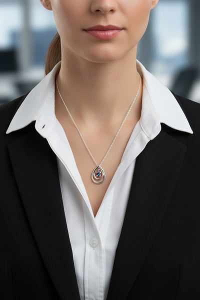 Double teardrop shapes around a blue montana sapphire