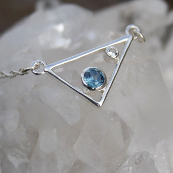 Silver triangle necklace with blue Montana sapphire