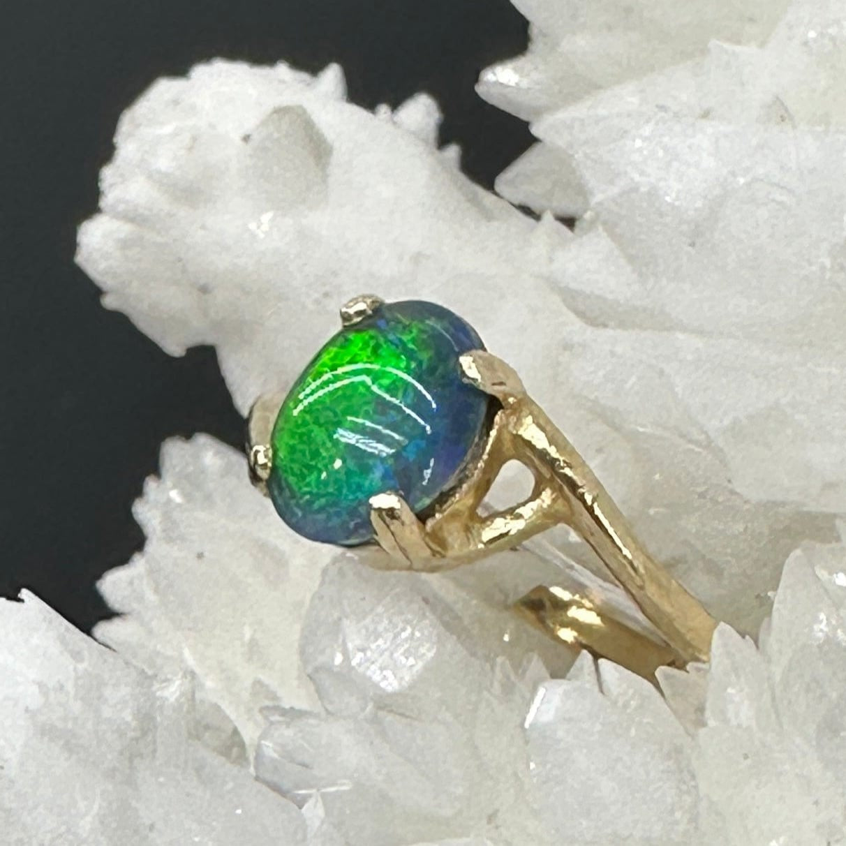 Gold ring with a green and blue Idaho opal 