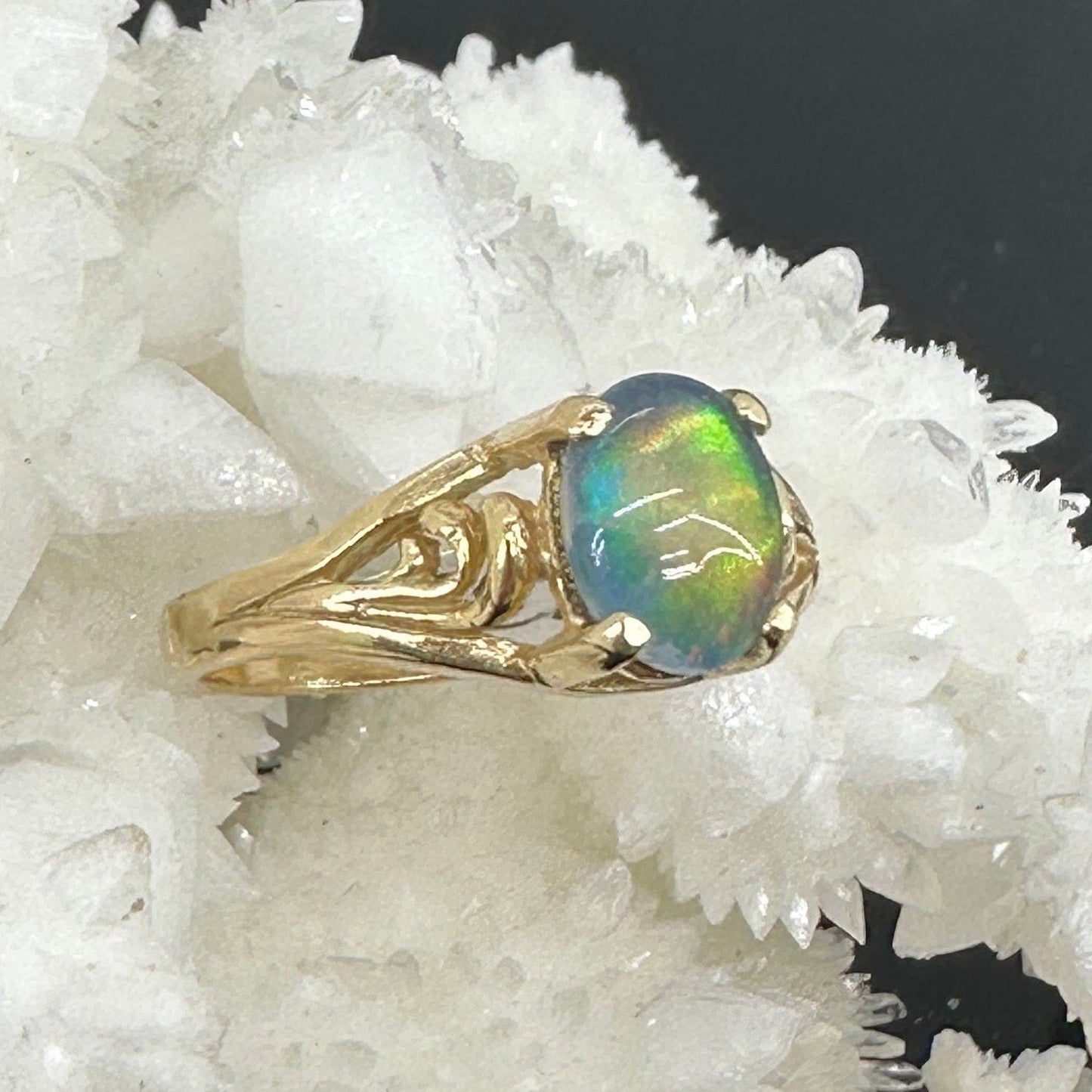 Gold opal ring on crystal