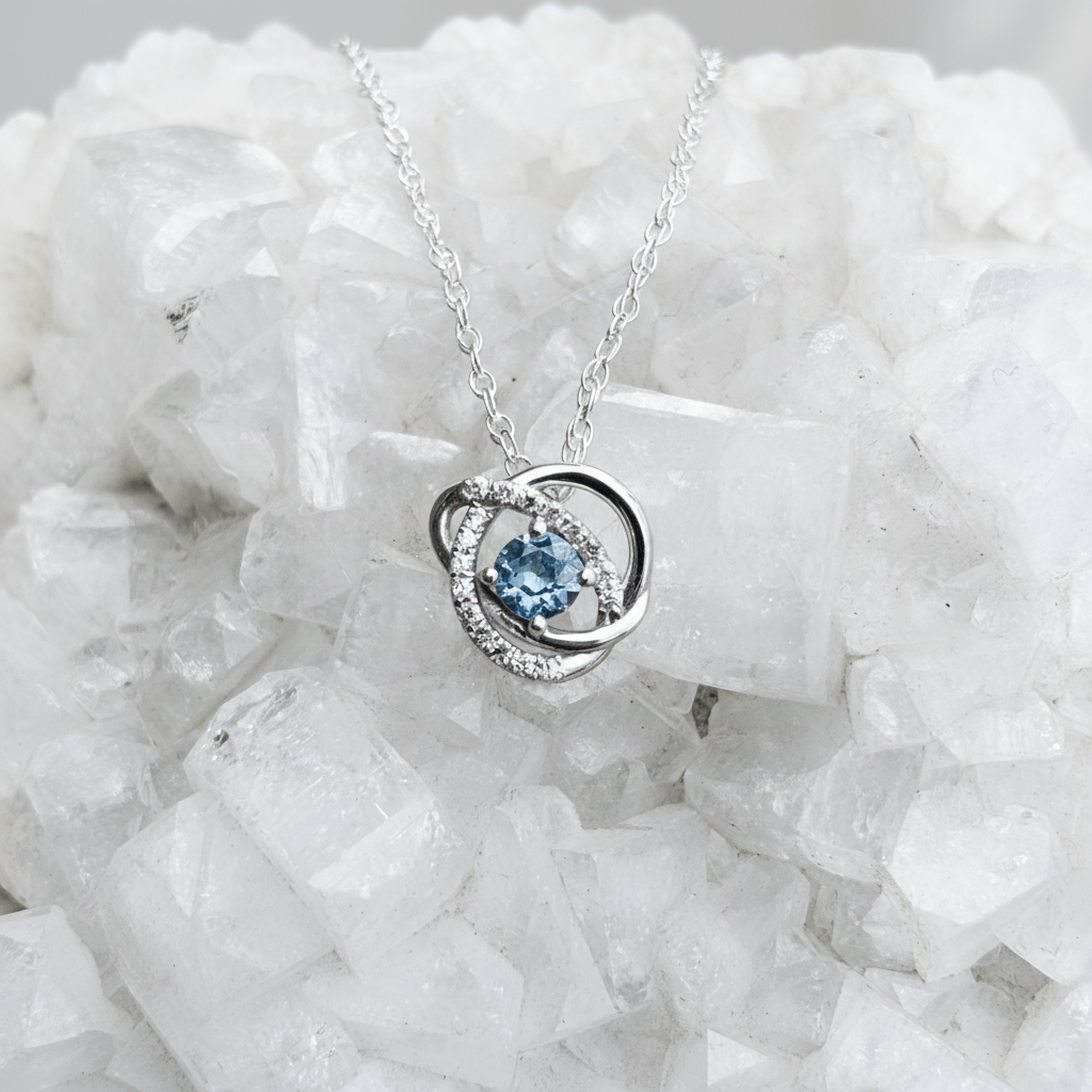 Infinity halo Montana sapphire accented sterling pendant