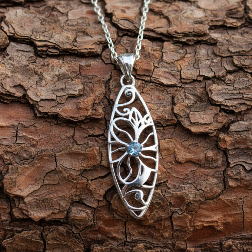 Silver flower pendant necklace on quartz crystal