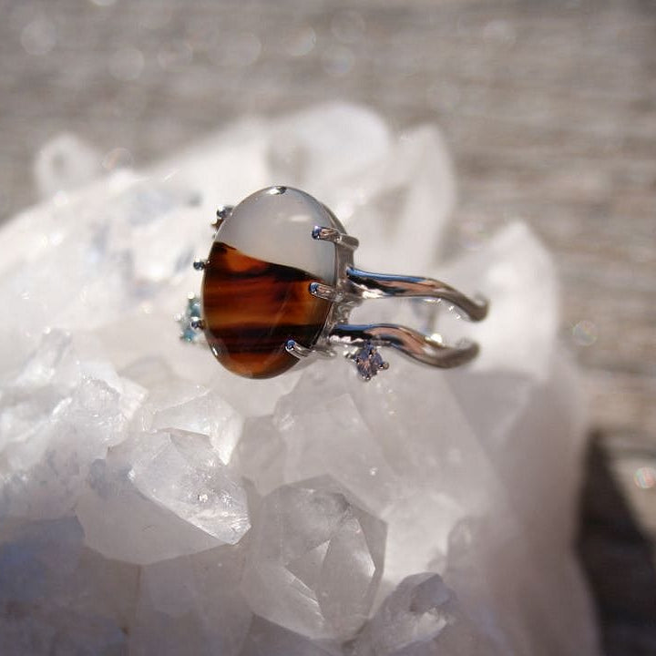 Montana agate ring with natural tones and sapphire accents