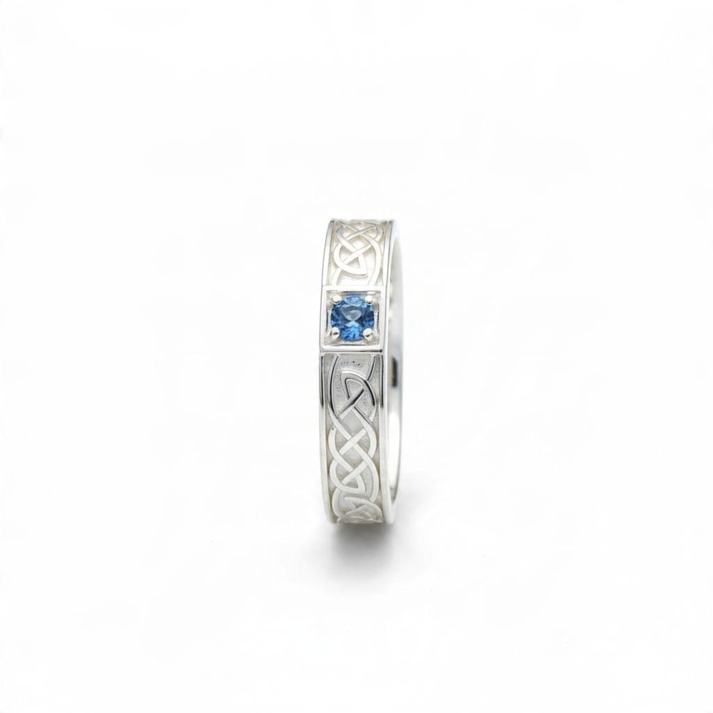 Montana Gems and Sapphire Jewelry sterling silver ring featuring a blue Montana sapphire and intricate Celtic knotwork.