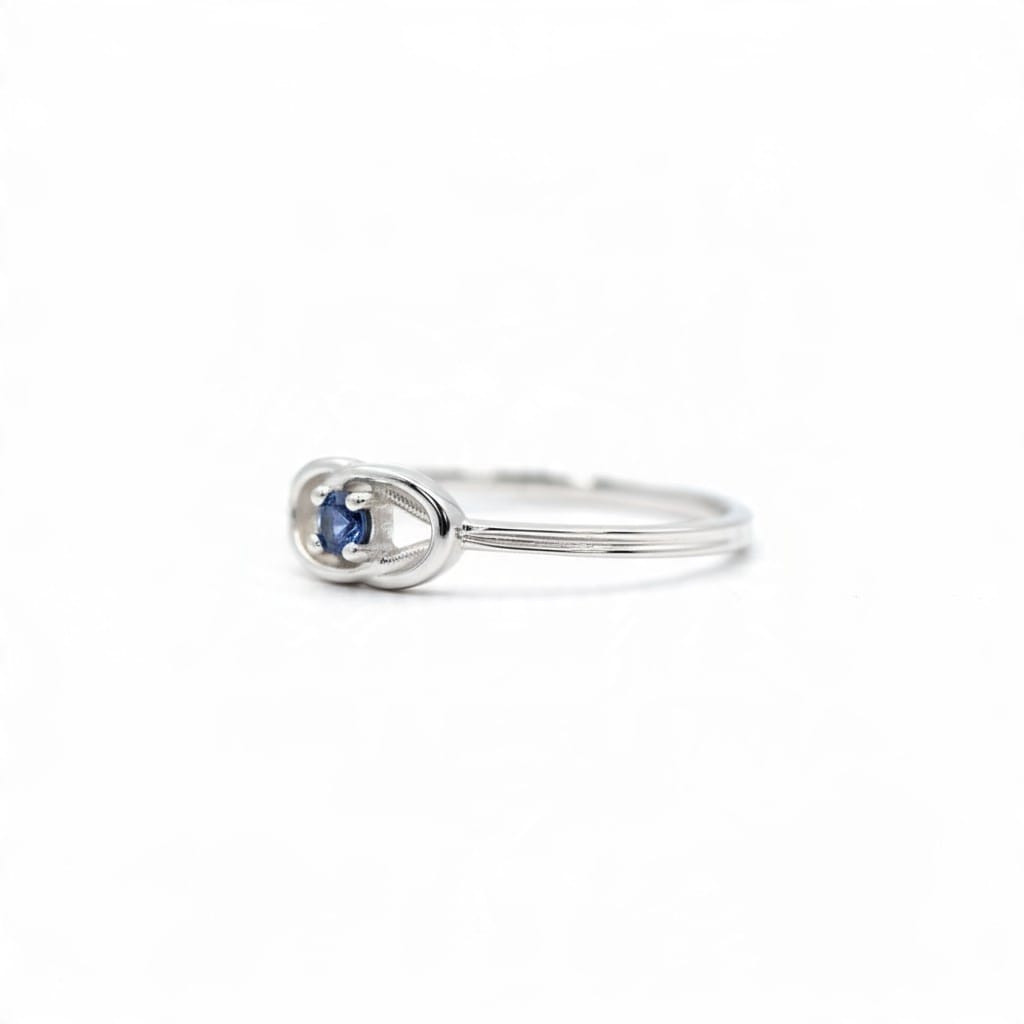 Montana Gems and Sapphire Jewelry white gold ring featuring a blue Yogo sapphire in a delicate Celtic knot setting.