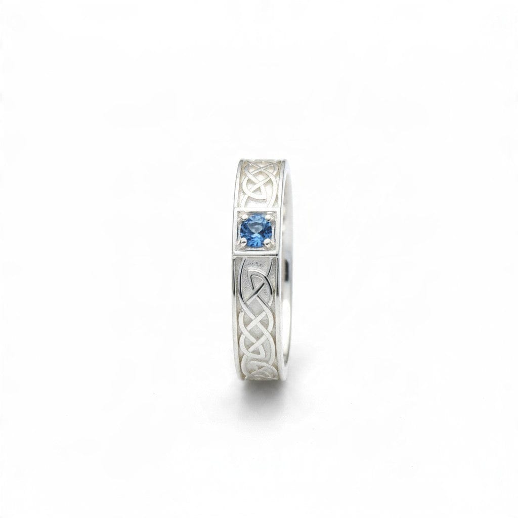 Montana Gems and Sapphire Jewelry sterling silver ring featuring a blue Montana sapphire and intricate Celtic knotwork.