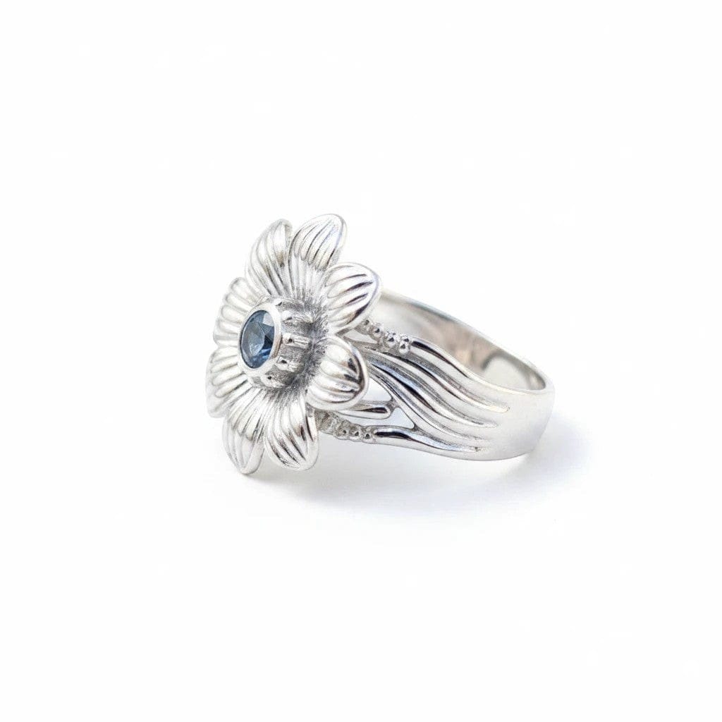 Montana Gems and Sapphire Jewelry sterling silver flower ring with a central blue Montana sapphire gemstone.
