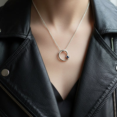 Silver circular pendant necklace with blue Montana sapphire 