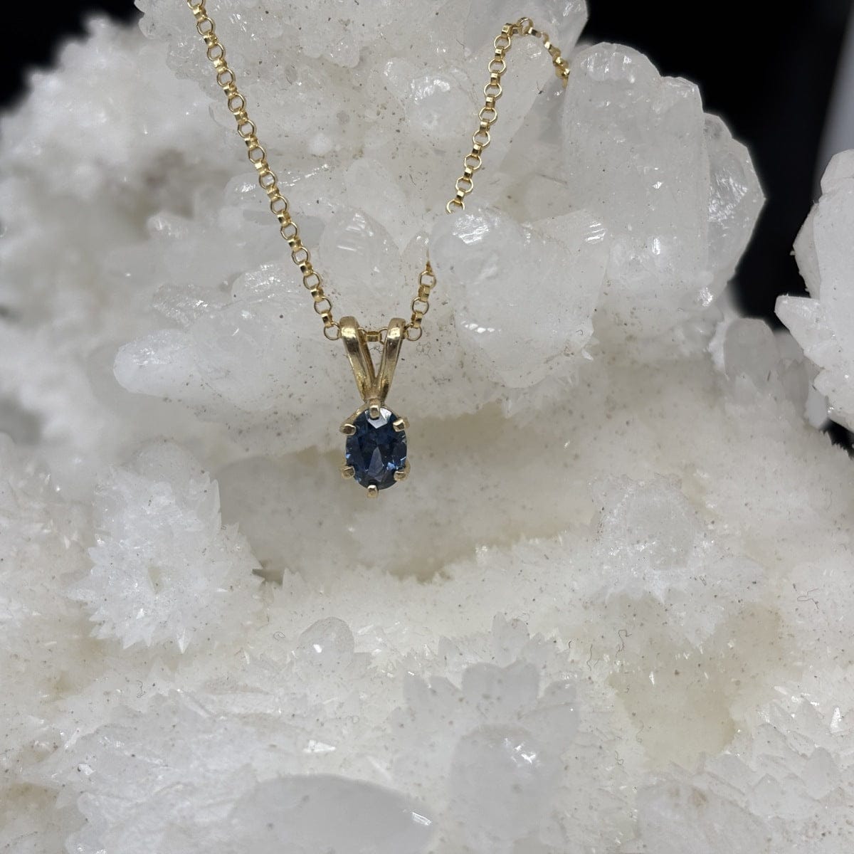 blue oval montana sapphire in a solitaire pendant