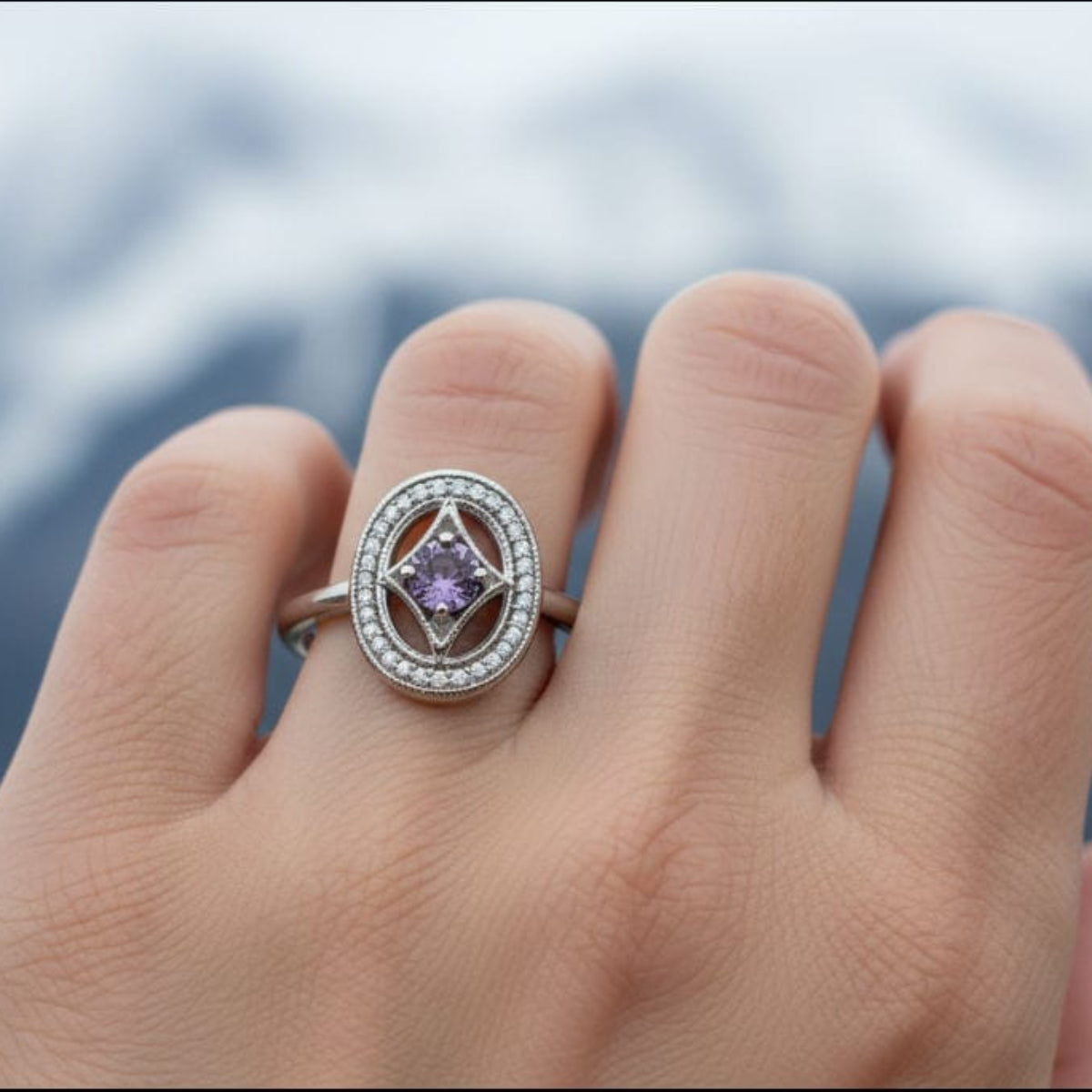 Pink Montana sapphire in a shield design band with diamond accents