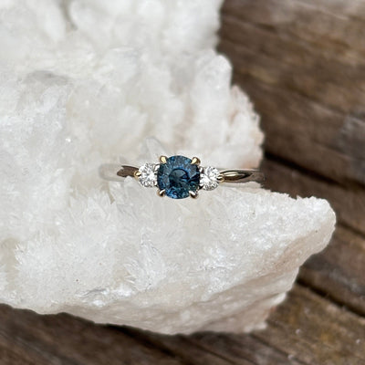 Large Teal sapphire and diamond engagement ring in two tone band. 