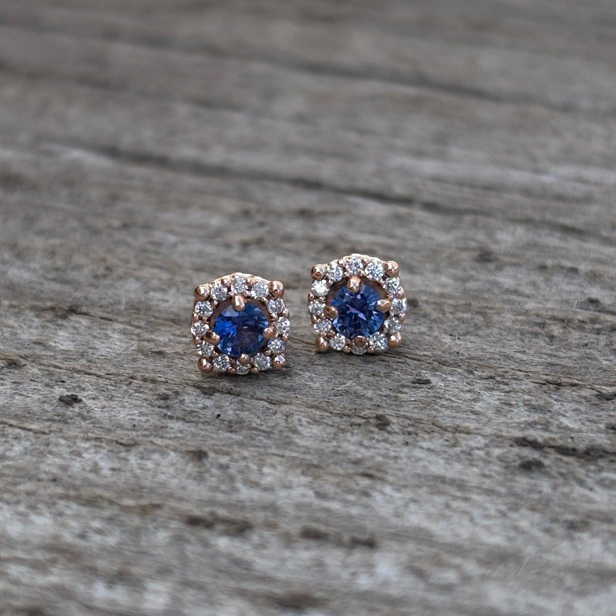 Yogo sapphire with diamond halo in rose gold earrings