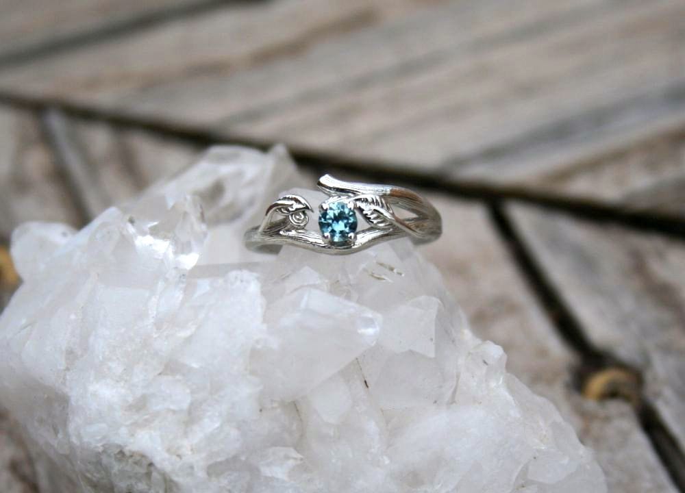 R310S Aquamarine gemstone ring on crystal