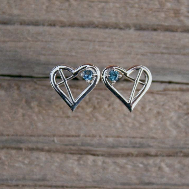 Silver heart earrings with cross and Montana sapphires.
